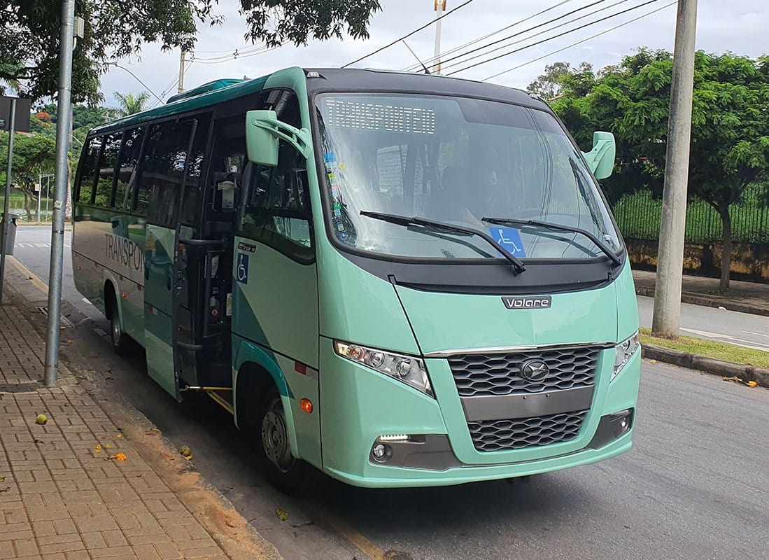A branded Transponteio coach beside a street